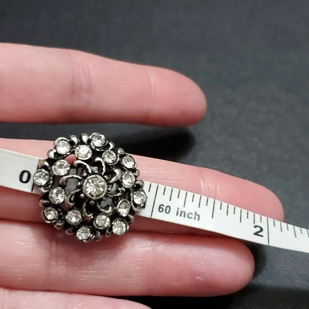 Silver tone flowery rhinestone ring
